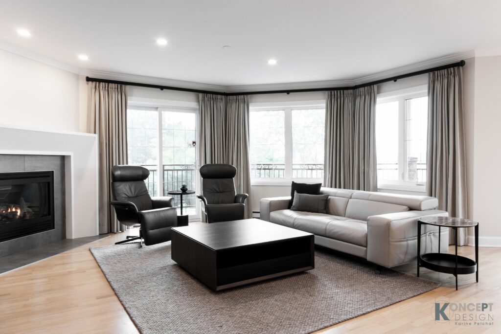 sofas en cuir, fauteuils en cuir noir, tapis gris, table carré moderne noire, salon neuf